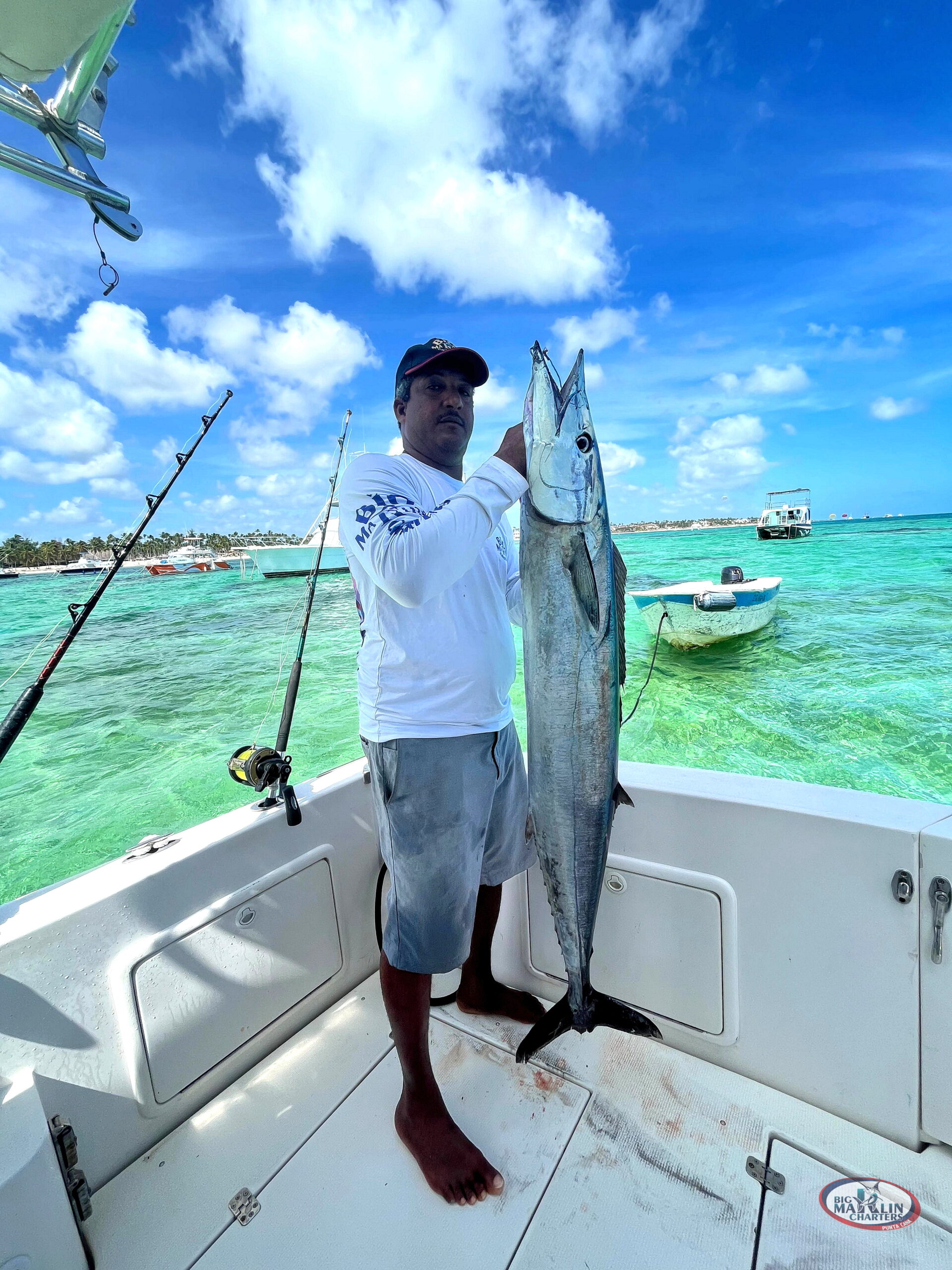 Big pelagic fish Wahoo and fishing boat Gone Dog