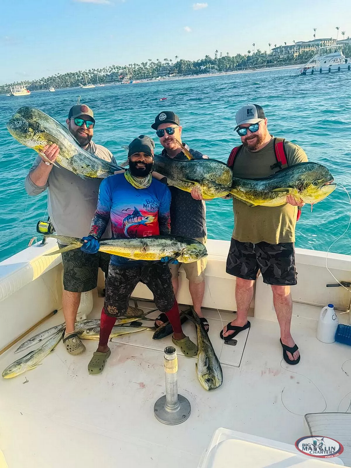 Angler posing with a freshly caught wahoo during a trolling fishing charter in Punta Cana, Dominican Republic.